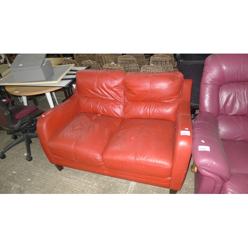 1111 - 1 red upholstered two person sofa