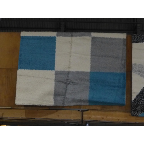 366 - A modern blue, white and grey square patterned rug