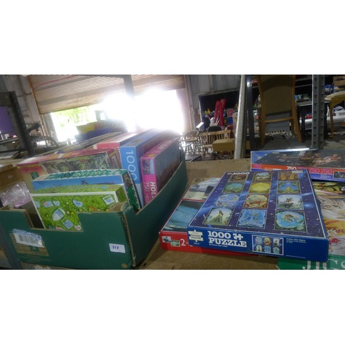 117 - A quantity of various jigsaw puzzles. Contents of one bay / 3 shelves