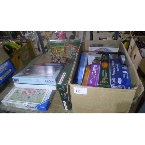 117 - A quantity of various jigsaw puzzles. Contents of one bay / 3 shelves