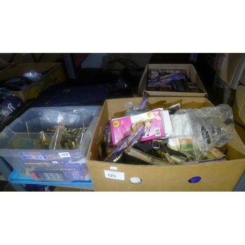 123 - A quantity of various items including nail varnish, hair dye, DVDs, gift / novelty items etc. Conten... 