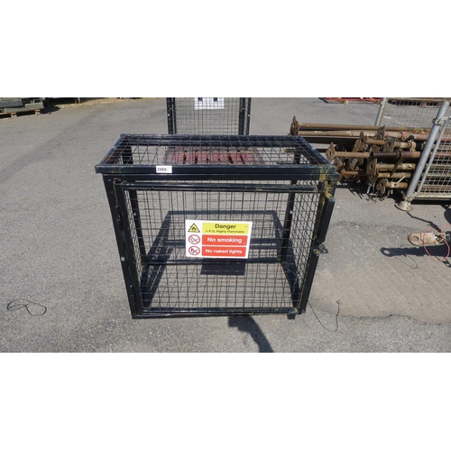 2989 - 1 black metal mesh bolt down gas bottle cage approx 1m wide, 50cm deep x 90cm high