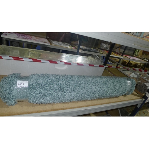 3517 - A teal/grey fluffy rug, please see pictures for more details