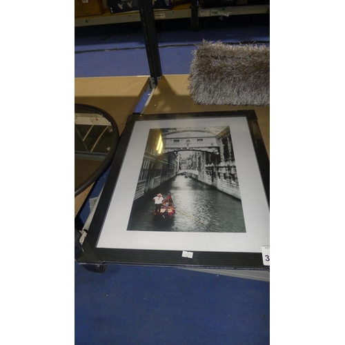 3587 - A framed print of a gondola in Venice