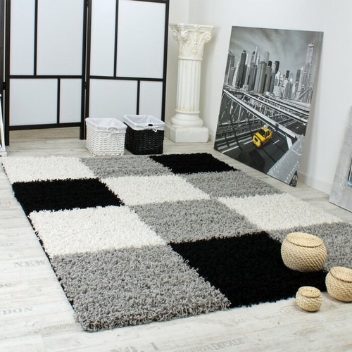 3062 - A grey black and white shaggy rug by Zip Code Designs approx 200 x 290cm  RRP £99