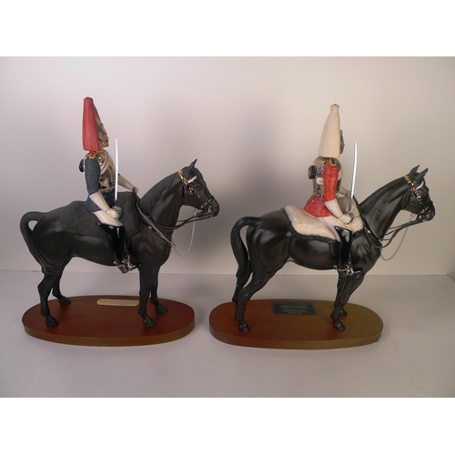 122 - A Beswick figure of a mounted lifeguard officer and a Royal Doulton figure of a mounted blues & roya... 