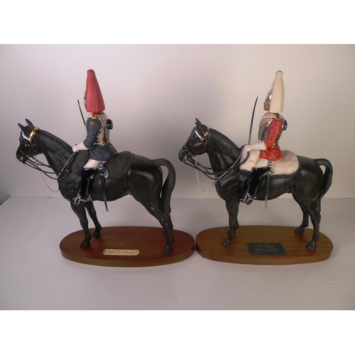 122 - A Beswick figure of a mounted lifeguard officer and a Royal Doulton figure of a mounted blues & roya... 