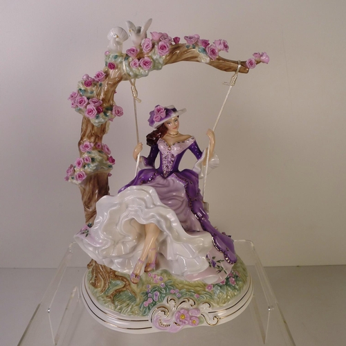 125 - A Royal Worcester figurine of a lady on a swing "Summer's dream" 32cm tall, limited edition