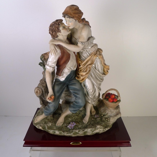 133 - A large decorative group of two lovers, 42cm tall