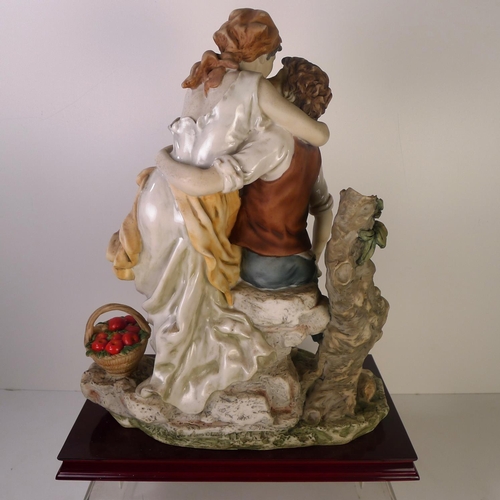 133 - A large decorative group of two lovers, 42cm tall