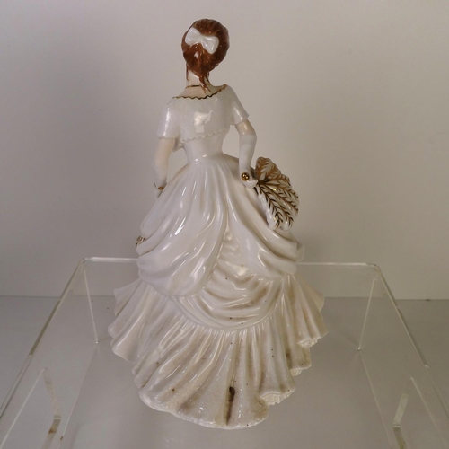 138 - A Royal Worcester figurine of a lady 