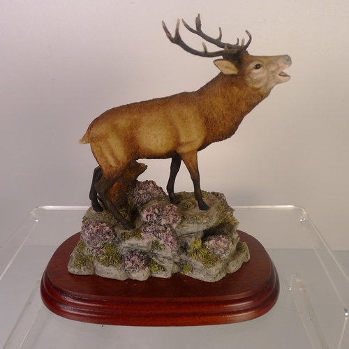 141 - A small resin stag, 18cm tall