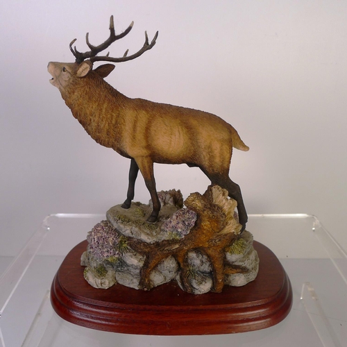 141 - A small resin stag, 18cm tall