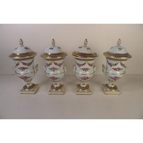 146 - A set of 4 floral decorative Dresden urns with lids, 23cm tall