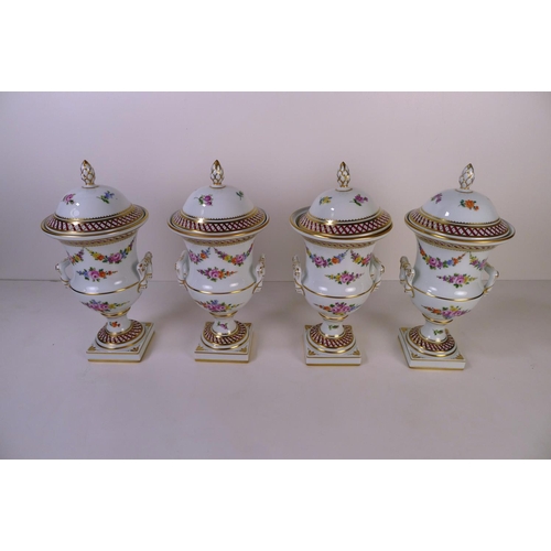 146 - A set of 4 floral decorative Dresden urns with lids, 23cm tall