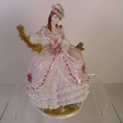 148 - A Royal Worcester figurine of a lady 