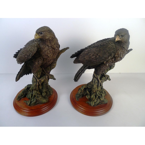 156 - A pair of bronze coloured resin birds of prey, 24cm tall