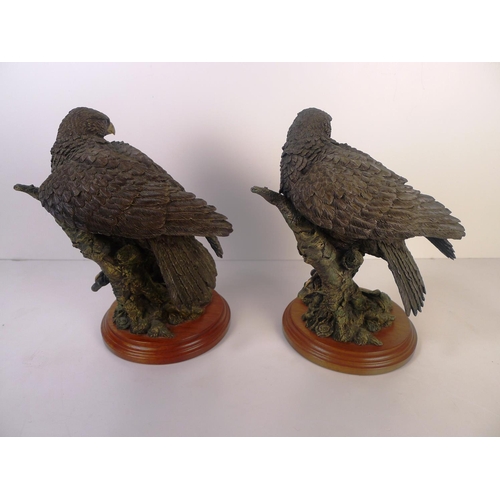 156 - A pair of bronze coloured resin birds of prey, 24cm tall