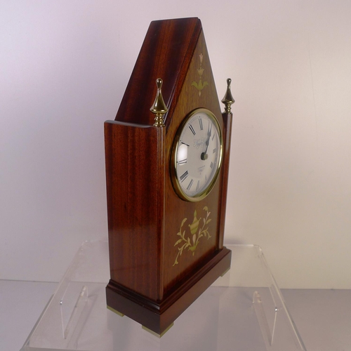 157 - A marquetry inlaid mahogany gothic style mantel clock by Knight and Gibbins, 32cm tall