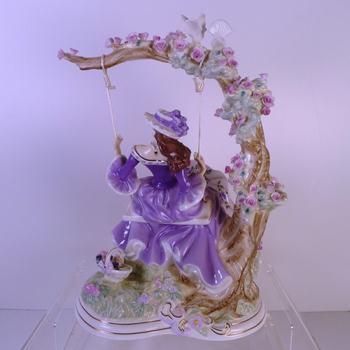 158 - A Royal Worcester figurine of a lady on a swing 