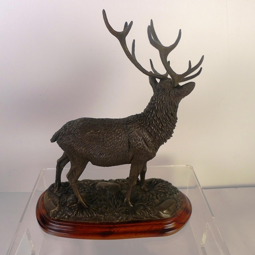 171 - A bronze coloured resin stag, 28 cm tall