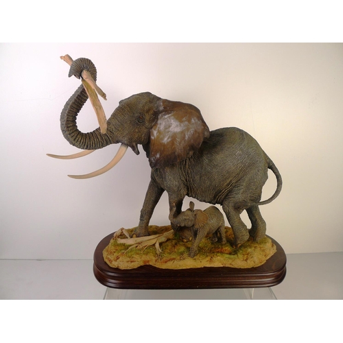 178 - A country artists Elephant and calf, 39cm tall 