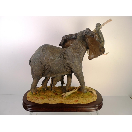 178 - A country artists Elephant and calf, 39cm tall 