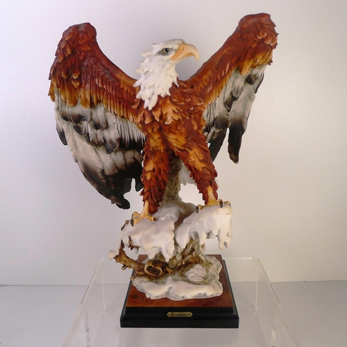 185 - A resin bird of prey, 39cm tall