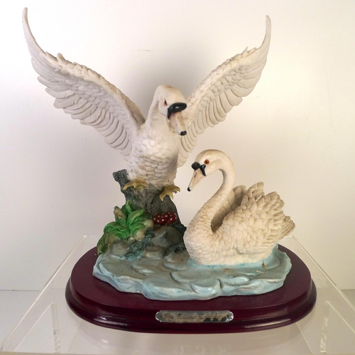 187 - A resin group of two Swans, 27cm tall