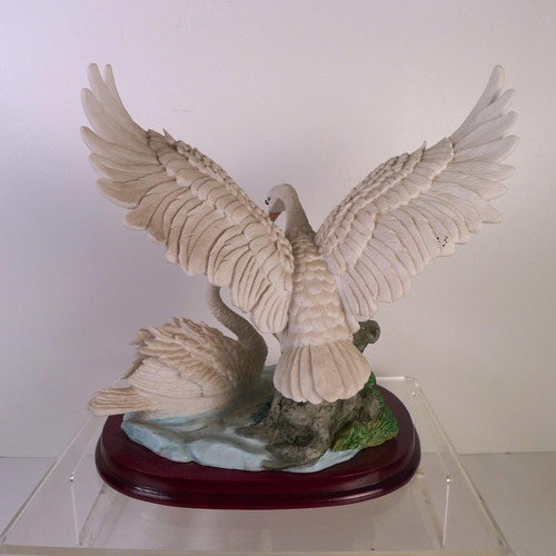 187 - A resin group of two Swans, 27cm tall