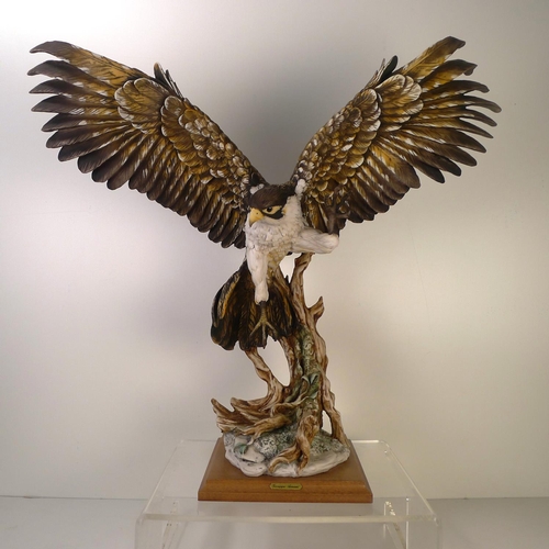 193 - A resin bird of prey, 52cm tall