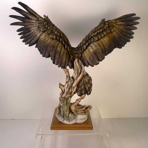 193 - A resin bird of prey, 52cm tall