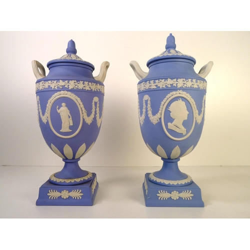 278 - 2 similar Wedgwood blue and white jasperware urn shape vases each with two handles and a lid 32cm ta... 