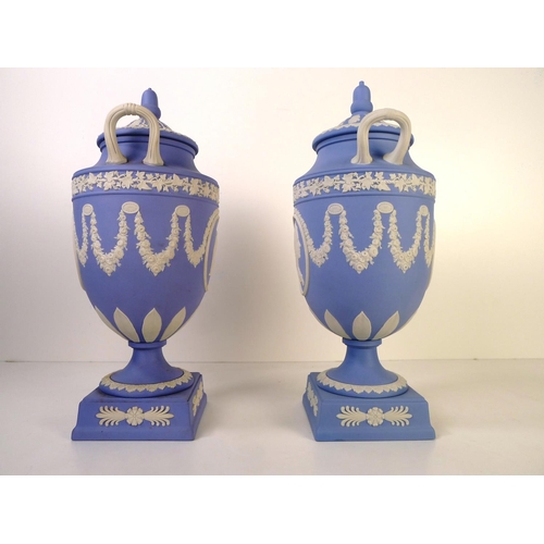 278 - 2 similar Wedgwood blue and white jasperware urn shape vases each with two handles and a lid 32cm ta... 