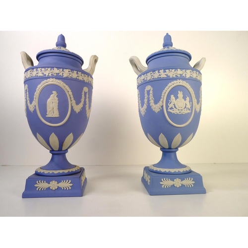 278 - 2 similar Wedgwood blue and white jasperware urn shape vases each with two handles and a lid 32cm ta... 