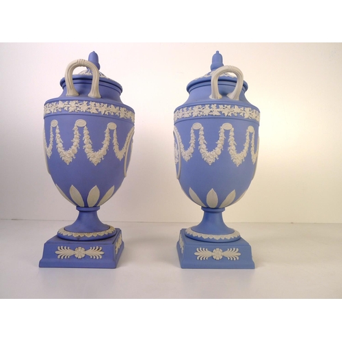 278 - 2 similar Wedgwood blue and white jasperware urn shape vases each with two handles and a lid 32cm ta... 