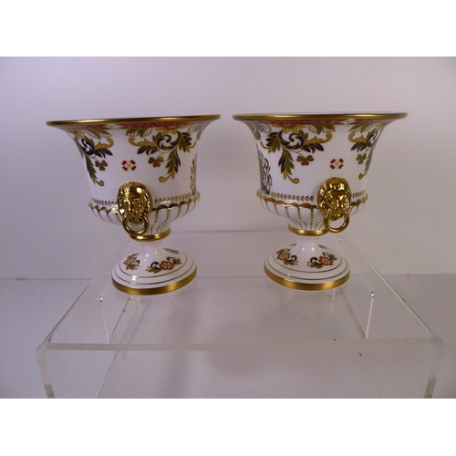 303 - 2 Royal Worcester limited edition diamond jubilee trophy cups, 15cm tall