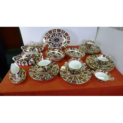 334 - A Royal Crown Derby old Imari 1128 dinner service comprising; 2 tureens, gravy boat & saucer, oval m...