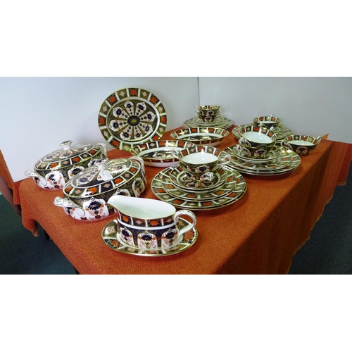 334 - A Royal Crown Derby old Imari 1128 dinner service comprising; 2 tureens, gravy boat & saucer, oval m... 