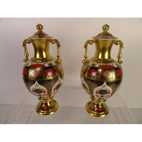 349 - A pair of Royal Crown Derby old Imari 1128 Sudbury vases with covers, 20cm tall. With boxes