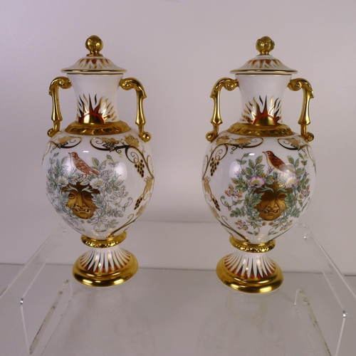 358 - A pair of Royal Crown Derby imited edition Summer Solstice Sudbury vases with covers, 19cm tall