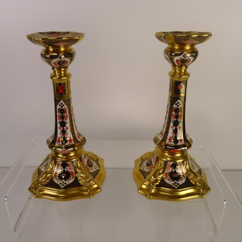 359 - A pair of Royal Crown Derby old Imari 1128 castleton candlesticks 17 cm tall.