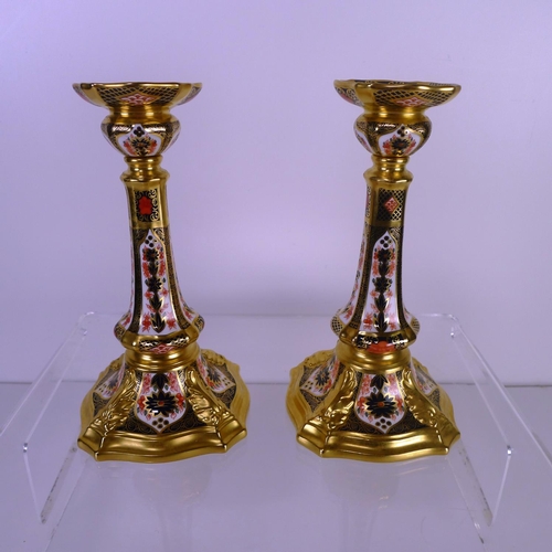 359 - A pair of Royal Crown Derby old Imari 1128 castleton candlesticks 17 cm tall.