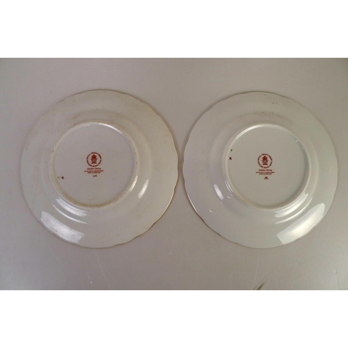 363 - A pair of Royal Crown Derby golden peony plates, 22cm diameter, with boxes