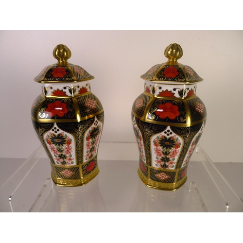 381 - A pair of Royal Crown Derby old Imari 1128 hexagonal jars with covers, 17cm tall