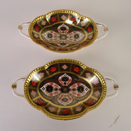 383 - A pair of Royal Crown Derby old Imari 1128 trays with handles, 22 cm long