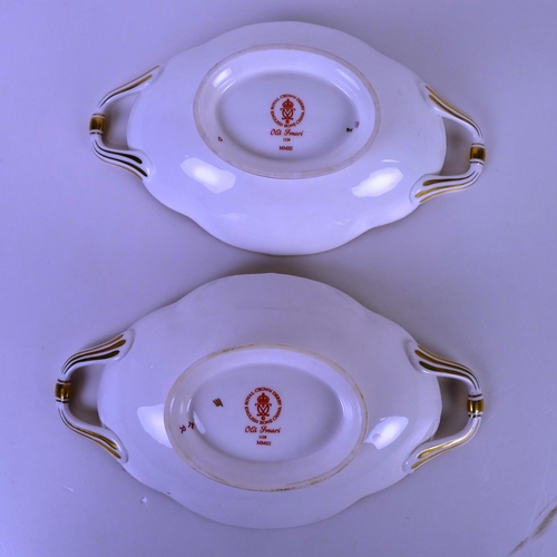 383 - A pair of Royal Crown Derby old Imari 1128 trays with handles, 22 cm long