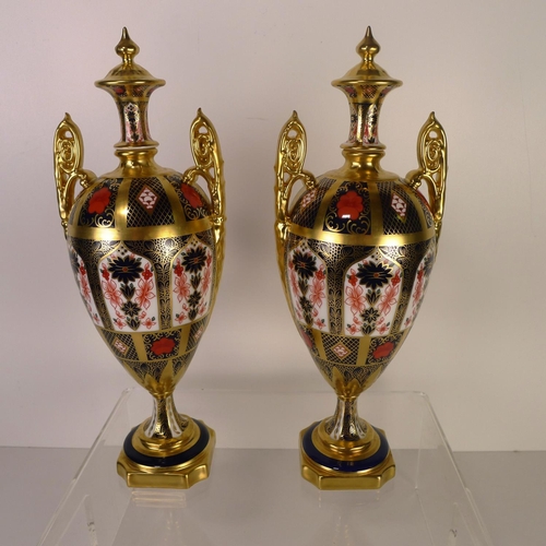 384 - A pair of Royal Crown Derby old Imari 1128 trophy vases, 32 cm tall, with boxes