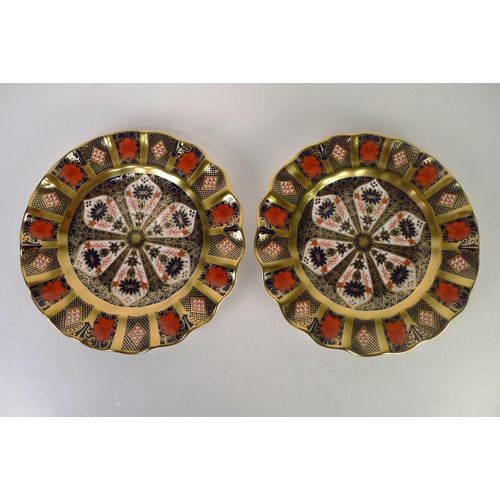 389 - A pair of Royal Crown Derby old Imari 1128 circular plates, 22cm diameter