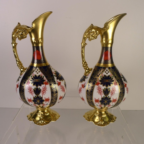 391 - A pair of Royal Crown Derby old Imari 1128 Swan neck pitchers, 26cm tall, with boxes